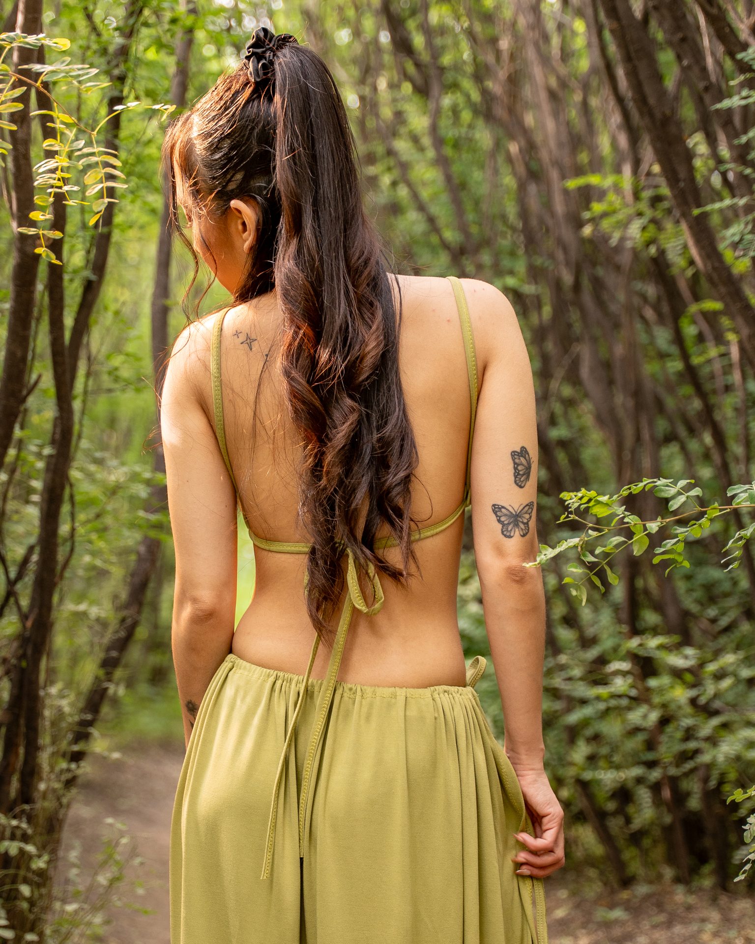 Portrait from behind on a wooded path
