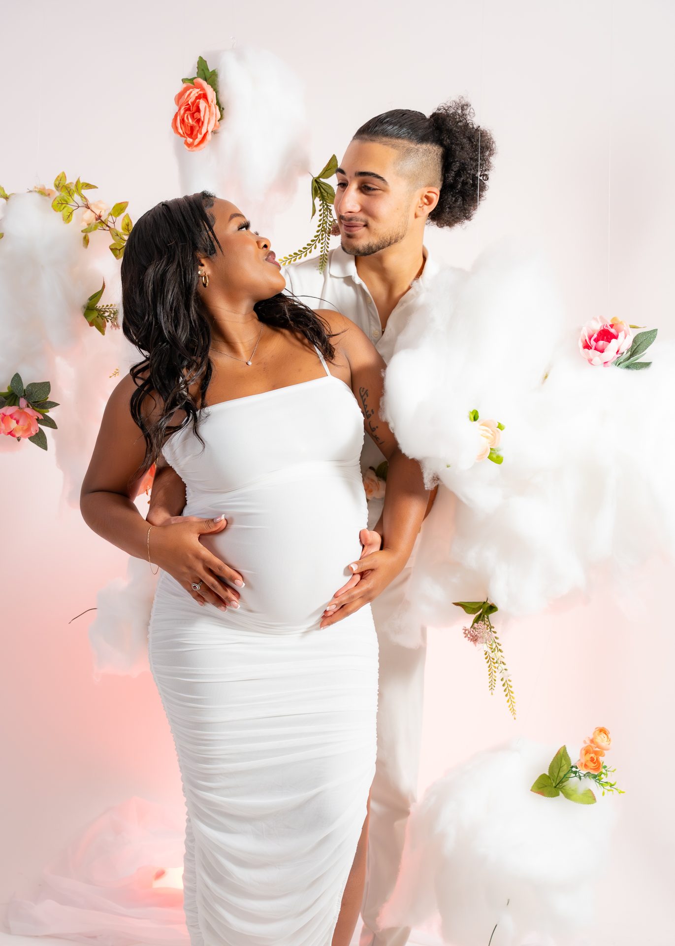 Maternity couple with a floral studio set